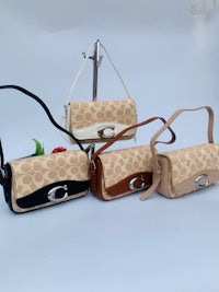 coach handbags in beige, brown and black